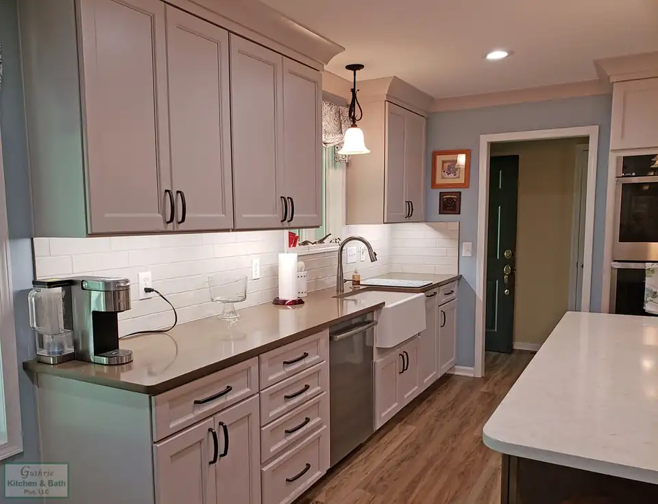 Kitchen remodeling Pleasant View TN: gray shaker cabinets, white subway tile backsplash, farmhouse sink and a quartz-topped island